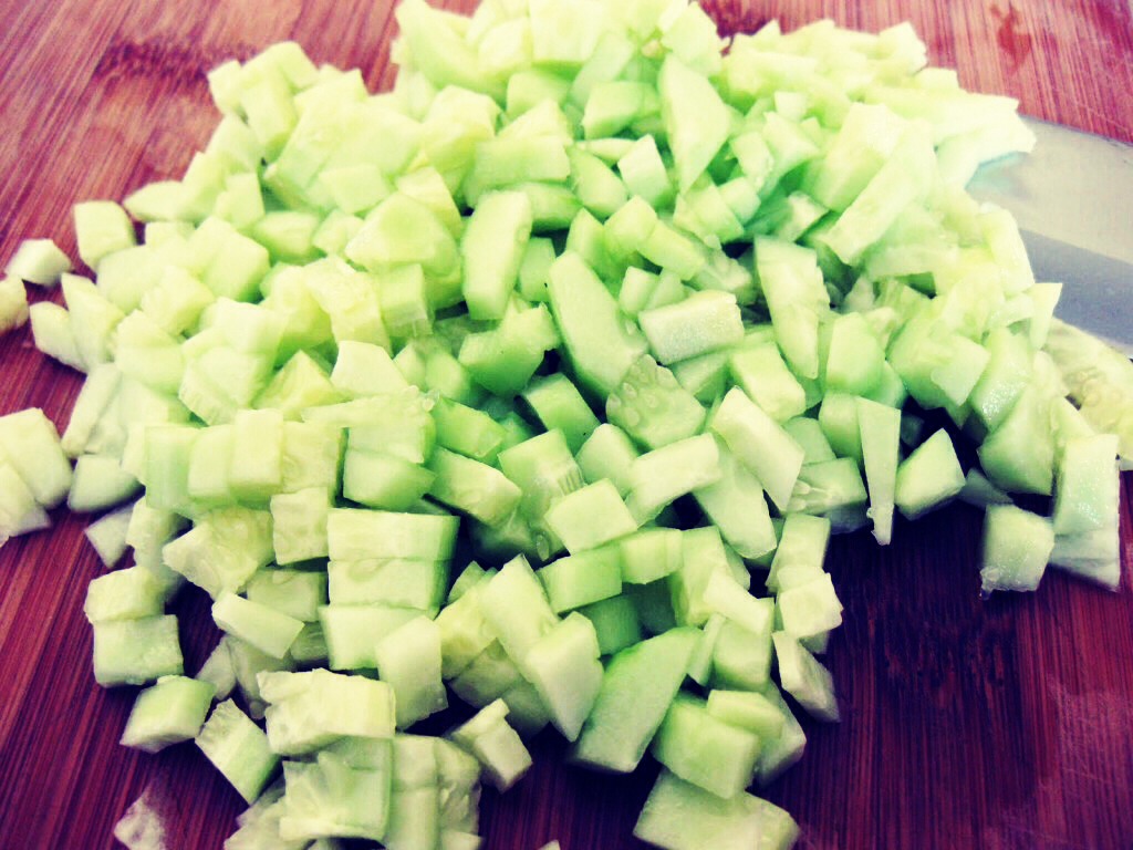 First, know how many people will be eating. If a large group, use a whole cucumber/more than one cucumber. If alone, use 1/4 to 1/2 of a cucumber. Chop into medium sized chunks. (A little bigger than a pair of dice)