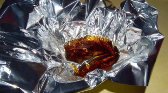 Dispose of that stubborn cooking grease by letting the liquid sit in aluminum foil. Once it solidifies, you can wrap the foil up and dispose of it mess free.