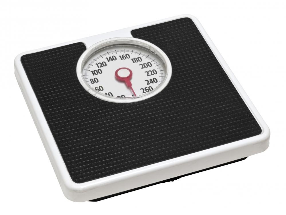 WATCH THE SCALES
If your regular weight increases several days in a row, it's a red flag letting you know you need to cut back a little or beef up your workouts slightly.