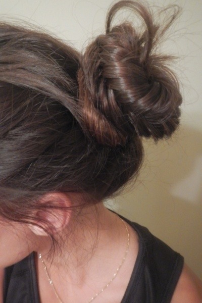 The Fishtail Braid: Bun
Try this easy alternative to the messy bun for quick post-run clean-up. The fishtail bun is practically prom-worthy, and testing found it tight enough to withstand a tempo.
Get this look by wrapping the fishtail braid around the base of the ponytail. Secure with a hair band.