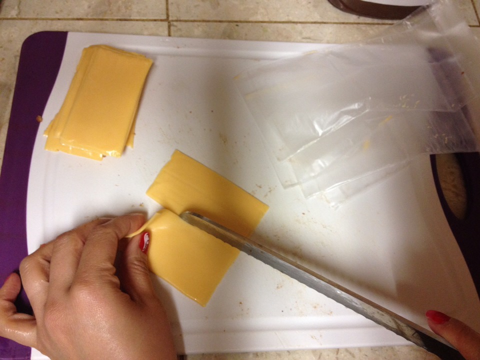 Cheese slices - 8 slices

1. Cut each slice in half. 
2. You should have 16 slices of cheese. 
