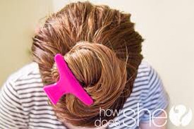 Once your hair is soaked with oil, twist your hair into a bun or ponytail. Use a hair tie to keep hair in place