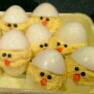 make fantastic devil egg chicks with these simple steps: make devil eggs like normal( hard  boil eggs And cut them open lengthwise and scoop the yellow part out. add Mayonnaise and a little bit of paprika and put into the boiled egg whites)add raisins for eyes and a  carrot for a nose.