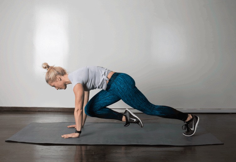 2. Mountain Climber 

From a high plank position, with your body straight and hips level, lift right foot and draw right knee to chest between your hands. As you return right leg to plank, lift left foot and draw left knee to chest between your hands. Continue to alternate as quickly as possible, keeping your core tight and without hiking your hips.