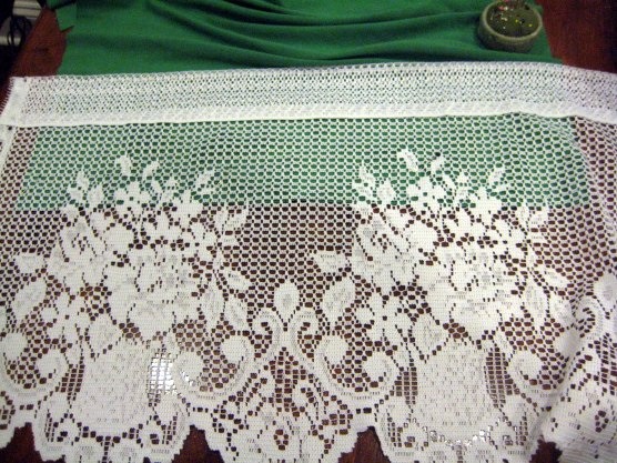I didn’t want just a straight line of lace, I wanted it to look like the $1100 scarf. So I started by sewing the lace on with part of the design on the jersey. Just using a zig zag stitch, I sewed a straight  along the edge of the jersey.

