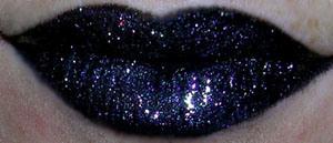 3. Add your preferred gloss, using the lip brush to gently paint the gloss on (I try to avoid getting black color into the lipgloss tube!). I like the super-sparkly silver MAC She-Zam dazzleglass:
