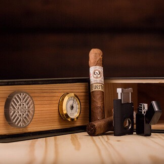Shelter Your Smoke Sticks  –  You may be fine roughing it in the woods, but your cigars have a higher standard. The Premium Cigar Humidor is a luxury suite of perfectly, humidified American cedar.