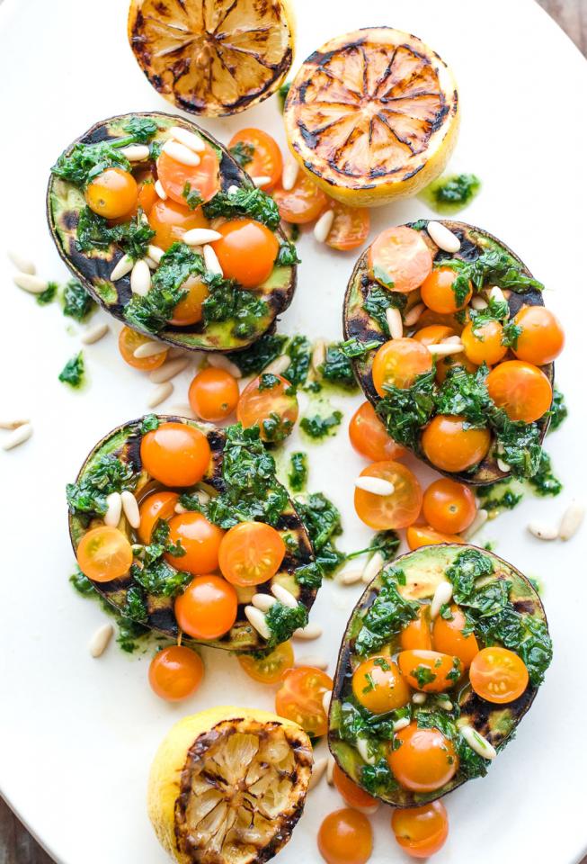 Grilled avocados with tomato, basil and lemon
