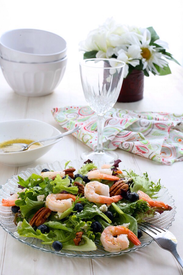 Blueberry Shrimp Salad with Lemon Dressing

Blueberries are still in season, and this salad is a great excuse to take advantage of that. Mixed with pecans, feta, and shrimp, this odd combo not only looks beautiful on the plate, but will feel good in your belly, too!