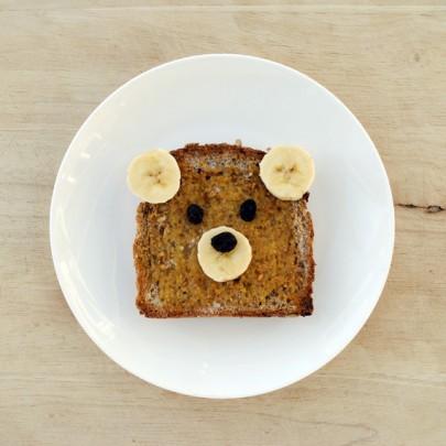 Now even as adults everyone can agree toast in a pretty basic food choice. take bananas and raisins to create this cute bear!