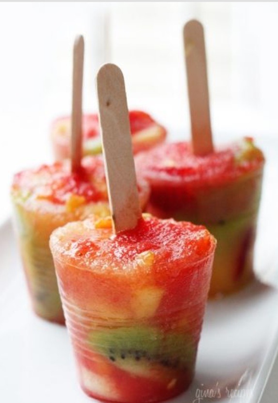 To make these cute Popsicles, poor a smoothie into a little plastic cup, put in the stick and freeze