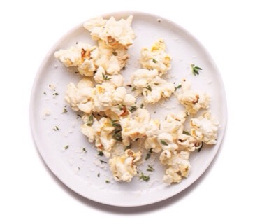 Savory Herb Popcorn
Dress up plain popcorn with grated Parmesan and fresh thyme for an addictive snack.