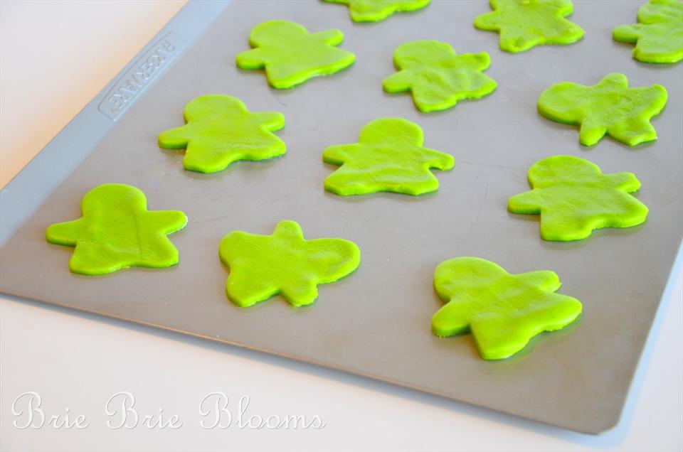 Use the gingerbread man cookie cutter to cut out the cookies and place on a non stick baking sheet.