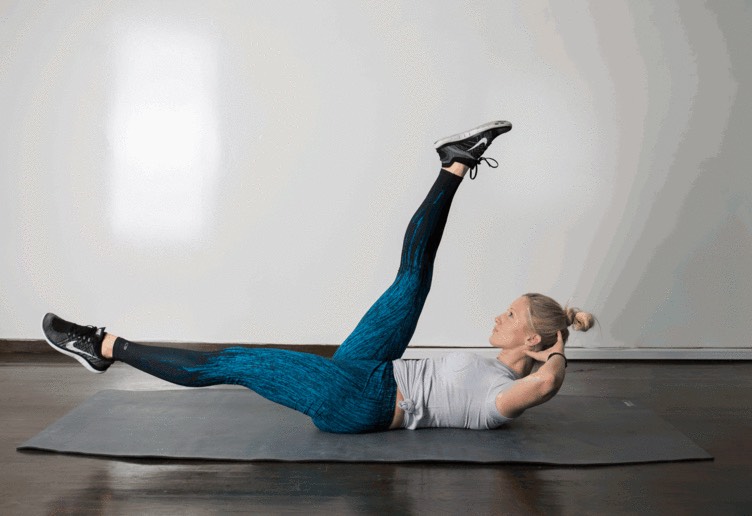 3. Scissor 

Lie faceup, hands behind your head, lifting head and shoulders off the floor. Using your abdominals, lift legs slightly off the ground and scissor kick, alternating one up and one down. Focus on not straining your neck or jutting your chin forward.