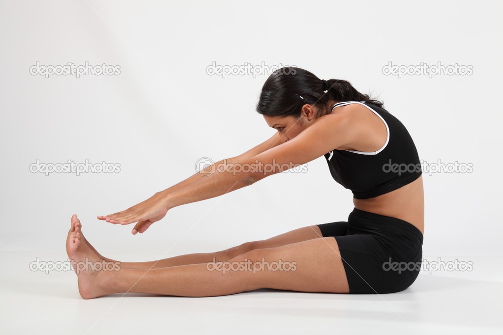 Try this stretch...it's called a pike stretch inhale as you stretch up exhale as you lower to your feet.