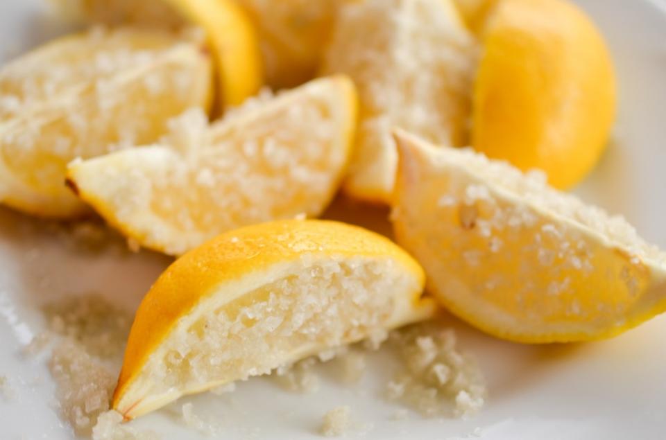 To exfoliate and rid your face of dead skin cells, try an all natural method by scrubbing a lemon with salt on your face.
