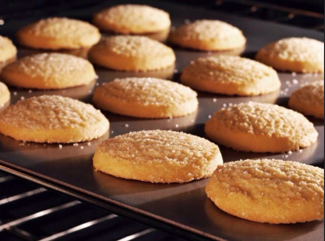 Take out your deliciously made from scratch sugar cookies and remove the cookies and place on a wire rack (if you have one) and let them cool for about 15-20 min.