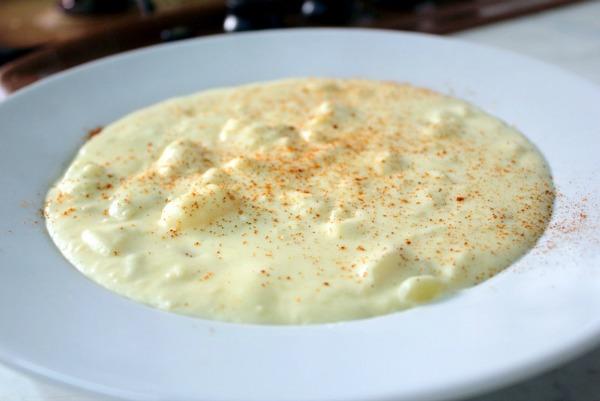 Add the cream cheese, I use a whole package of about 300 grams, shown in the picture.  Stir the soup until the cream cheese is melted.  At this point you can also add spices of your choice.  I add salt and pepper (white pepper is fabulous in it), and paprika.  You can add some red pepper if you want
