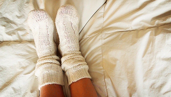 Give yourself a healing foot treatment while you sleep. Apply peppermint moisturizer or Vaseline to your tired and cracked feet, and then throw on some comfy, cushioned socks. And head to bed. That’s it. Wake up with soft, smooth feet.