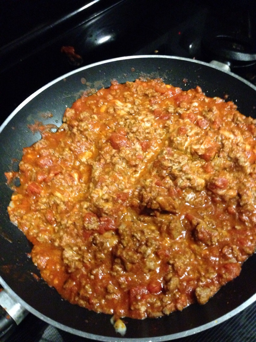 Begin your sauce at the same time you put your pasta noodles in the boiling water. You can buy premade sauce or make your own. I like to add mushrooms, onions and cheese. Try not to make it too runny.