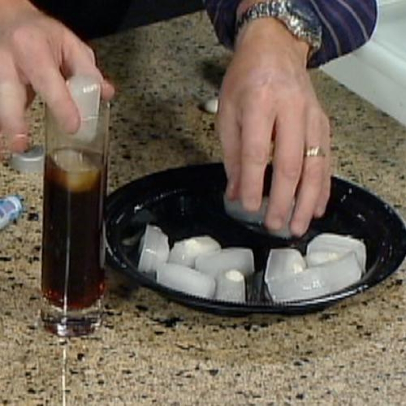 when the ice cubes are ready, pour out a glass of coke for your victem and add 1-2 ice cubes. As the ice melts the closer it gets to the mento, then BOOM it explodes!