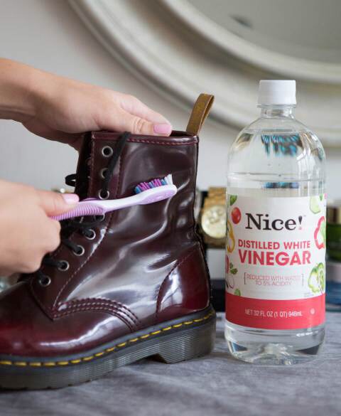 Scrub off water stains on leather boots with a soft toothbrush and vinegar.