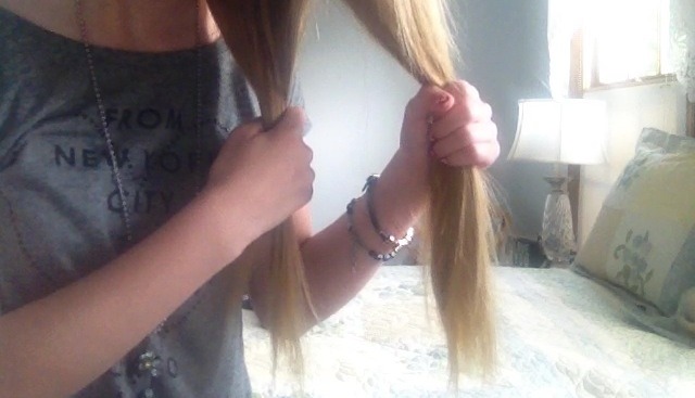 First, take your hair to one side of your head. Then, split it into two sections!!