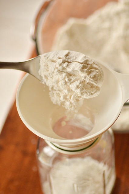 Place your funnel inside your 1 quart canning jar. Add flour and baking powder mixture.
