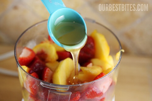  I always add a little somethin’ somethin’ to mine.  You can use granulated sugar, honey, or even splenda or agave syrup.  I’m going to add a little honey to my peach-strawberry mix. I added about 3-4 tablespoons. You can also add ground spices and extracts at this point. 