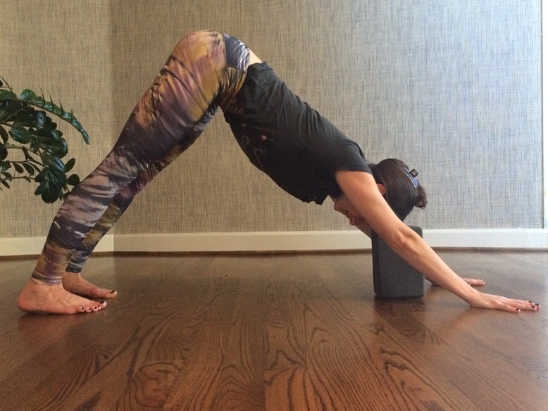 DOWNWARD DOG
The option to place a block or pillows beneath the head makes this pose even more restorative. As one of yoga’s most well-known poses, downward facing dog is a great stretch for yogis of all levels.