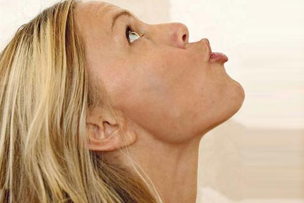 a. Open your mouth wide and move your lower jaw in an up and down movement as if you are trying to scoop out something with your lower jaw. You will notice your lower teeth touching your lower lip. Repeat this exercise 15 times and do it several times a day.