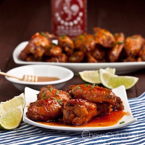 Sriracha and Honey Wings, a personal favorite of mine: http://www.chewoutloud.com/2013/09/24/honey-sriracha-chicken-wings/