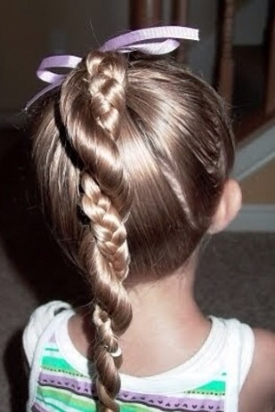 Easy hairstyle! Make a pony part it in half braid one side then twist the braid around the loose half. Put a tie at the bottom and your done. Note: use pomade it keeps the hair from frizzing