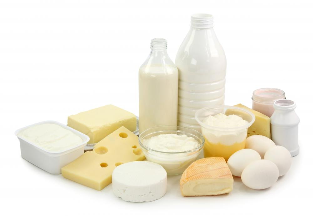 Stop eating white grains and dairy products. By eliminating foods that cause bloating, you will be able to look skinnier in no time. 

Don't starve yourself though, treat yourself to dairy food, but not as much as you may have beforehand! Remember: all in moderation!