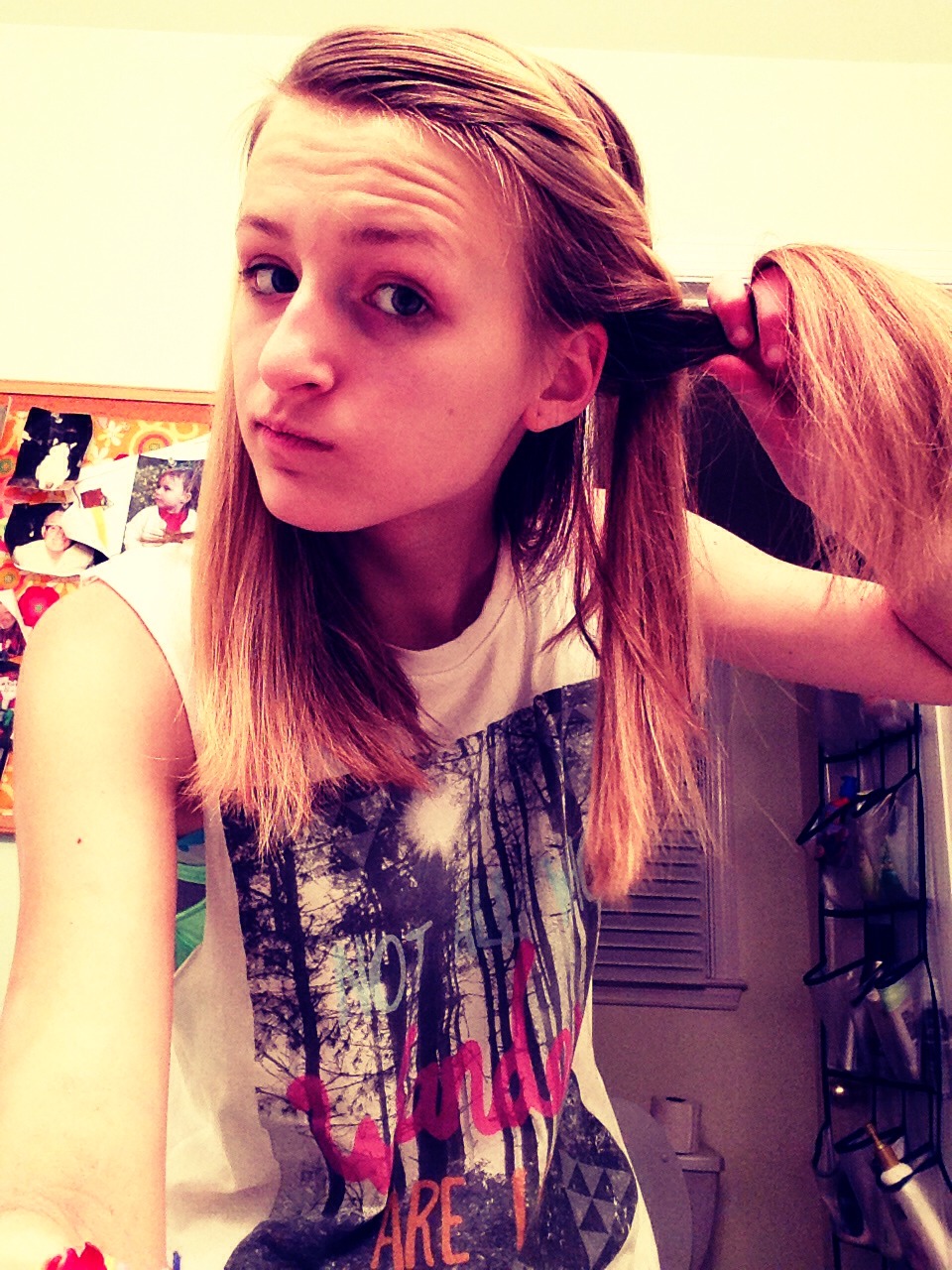 Do the same thing, take the second strand, add hair and pull it up and around