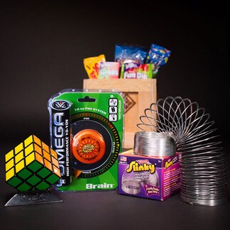 Fun Is A Spectrum  –  For some, the mere thought of climbing K2, running with the bulls, or salsa-dancing the night away is enought to pull a muscle. For these men, there's the Old School Crate: packed with the tools and fuel for pure, unadulterated, "no need to leave the house" fun!