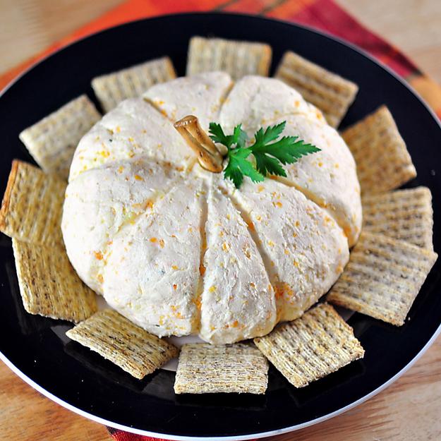 Big Pumpkin Cheese Ball

http://www.lolfoodie.com/archives/2010/10/pumpkin-shaped-cheese-ball/