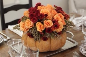 10. After Halloween, pumpkins are pretty cheap to buy, so hollow one out (use the pumpkin for a side dish) and create a unique DIY Thanksgiving centerpiece