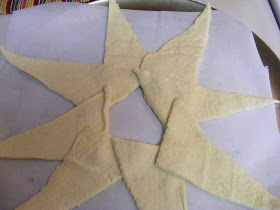 Preheat oven to 375 F degrees. Scramble your eggs on stove top. Lay out crescents
on a parchment lined pizza pan as shown above