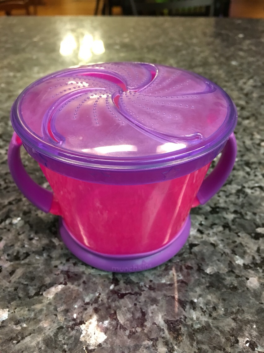 These spill reducing snack bowls are great for just about any snacks your toddler can use their hands for. Perfect for snack in the car. 
I got mine at Walmart but I've seen them in most stores that sell baby/toddler products.