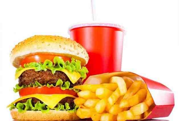 Don't stop eating junk food. Just stop eating it as often as you do. And If anything eat on a timetable...DOT STARVE YOURSELF. THAT'S THE WORST POSSIBLE MISTAKE!!!