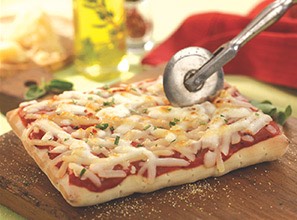 15. Herb Stretch dough into a 15-inch round. Top with olive oil, salt and chopped thyme and oregano. Bake until crisp, then brush with more olive oil.