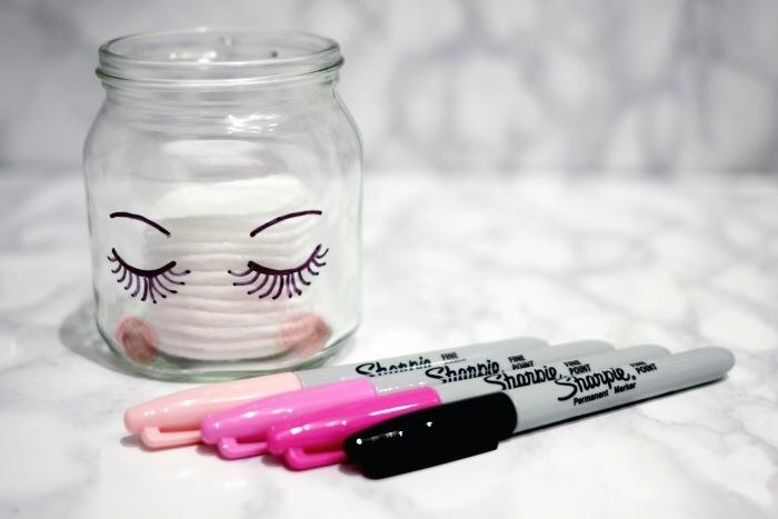 Dollar Store glass jars paired with a Sharpie or two makes a really cute way to store toiletries.