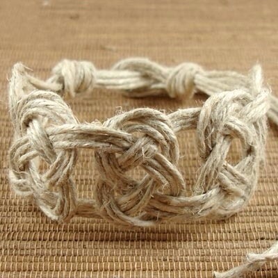 Pretzel Knot Hemp Jewelry

Full instructions here:
http://factorydirectcraft.com/factorydirectcraft_blog/adding-josephine-knots-hemp-bracelet/

Video:
http://m.youtube.com/watch?v=o6nGKJd51IE
