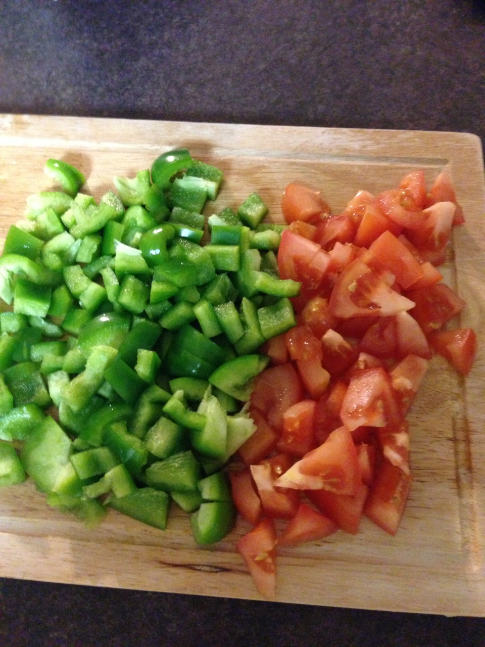 Cut green pepper and tomatoes into cubes