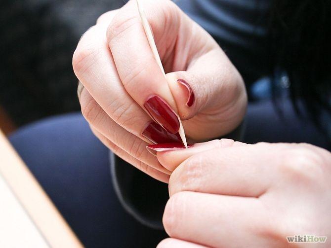 Push back your cuticles with a toothpick or a long, wooden cuticle pusher. This will help them to grow faster, Be sure you have a basic knowledge of doing this correctly before attempting it.

