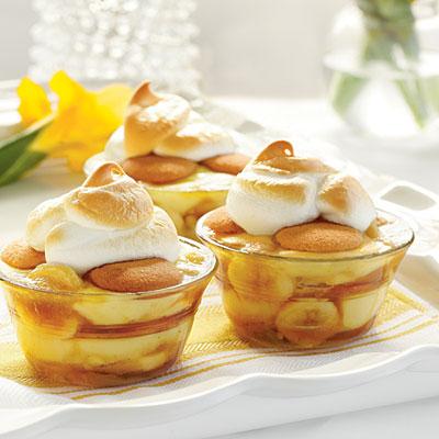 4. Beat 4 egg whites at high speed with an electric mixer until foamy. Add remaining 1/4 cup granulated sugar, 1 Tbsp. at a time, beating until stiff peaks form and sugar dissolves (2 to 4 minutes). Spread meringue over ramekins. Place ramekins on a baking sheet.