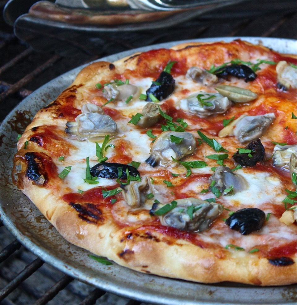 23. Clam Stretch dough into a 15-by-9-inch rectangle. Sprinkle with oregano and 1 cup shredded mozzarella, then bake until crisp. Top with 8 ounces chopped canned clams and 4 ounces sliced mozzarella; bake until melted.