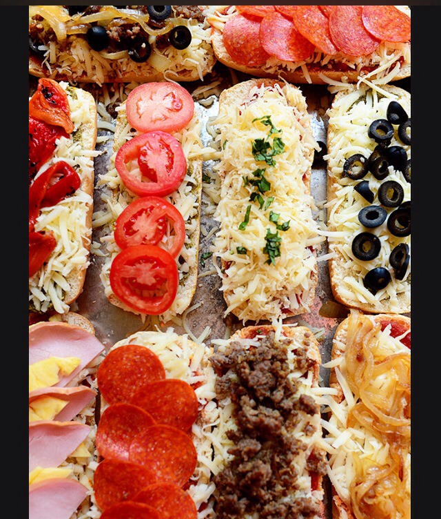 5) Crank up the heat to 425 and put it on the highest rack until the cheese starts to bubble a bit and turn golden.

6) Remove and serve immediately! You can cut the pizzas in half right across the middle so everyone can share. 