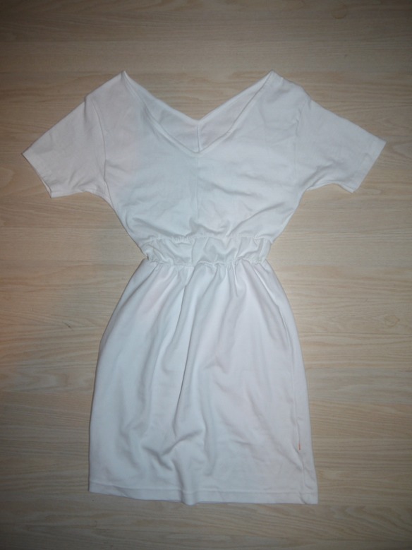 This is what the final product looks like. 
For a more finished look, you can finish the neck by using a spare strip of the t-shirt fabric. Sew it on and press.